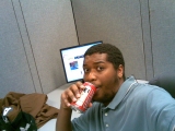 me, at work in denver, co in my cubicle drinking a tecate