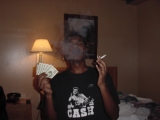 me, at hotel in baltimore, md smoking a cigarette with $100
