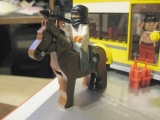 arabrick toting an rpg launcher on horseback